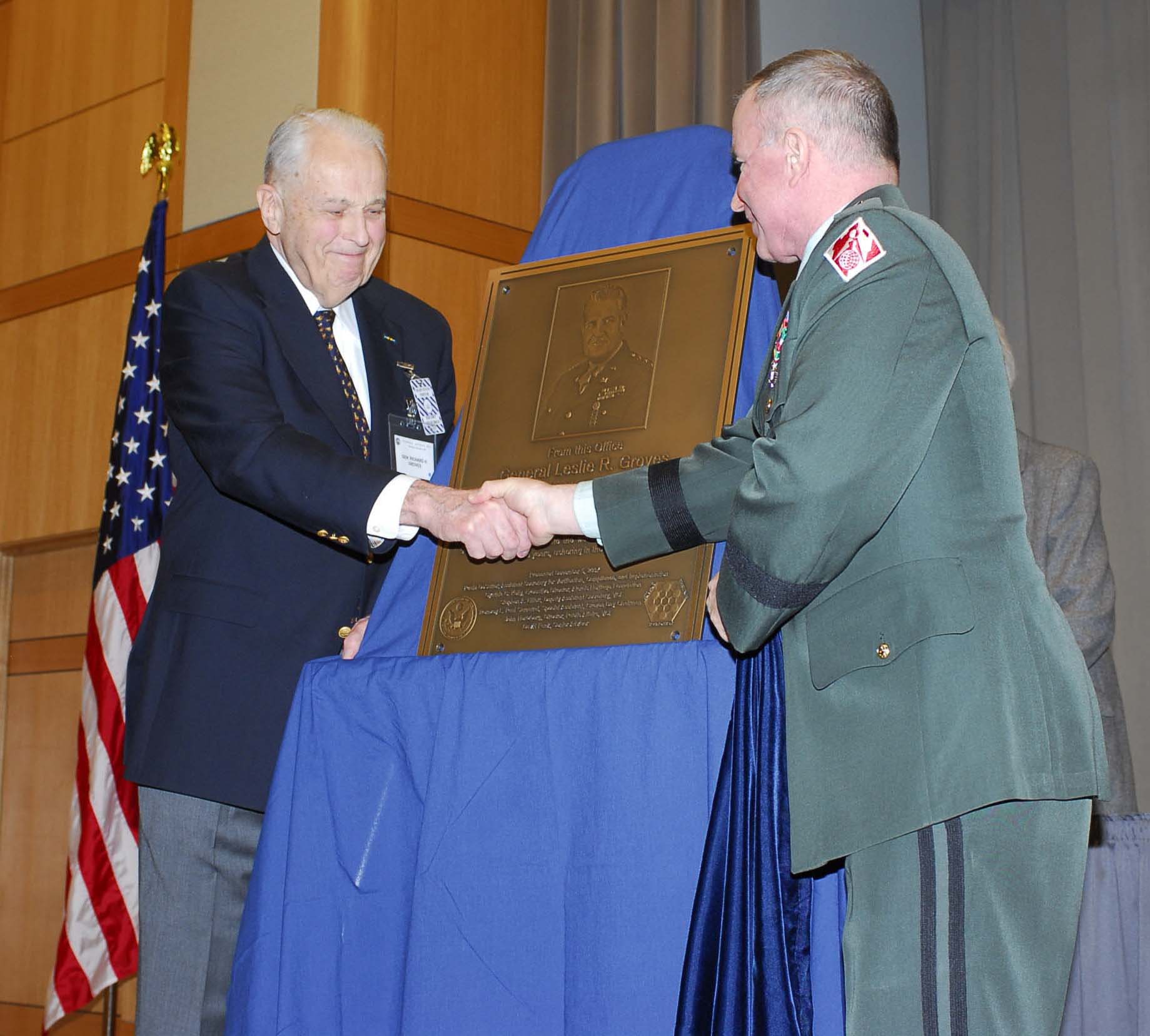 General Richard H. Groves receiving a plaque honoring his father from Major General Merdith W. B. Temple of the Army Corps of Engineers